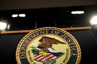 caption: A view of a lectern at the Department of Justice in Washington, D.C., on April 18, 2019. A retired U.S. Army officer has been accused accused of leaking classified national defense information related to the Russia-Ukraine war on a foreign dating website.