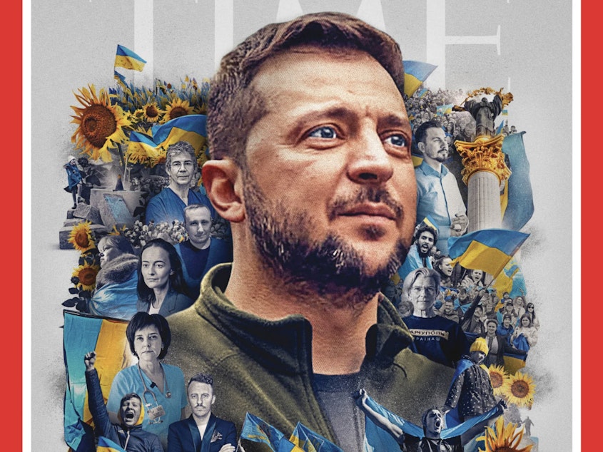 caption: <em>Time</em> magazine's cover shows Ukrainian President Volodymyr Zelenskyy, surrounded by other individuals and crowds of protesters woven together with bright yellow sunflowers and blue and yellow Ukrainian flags.