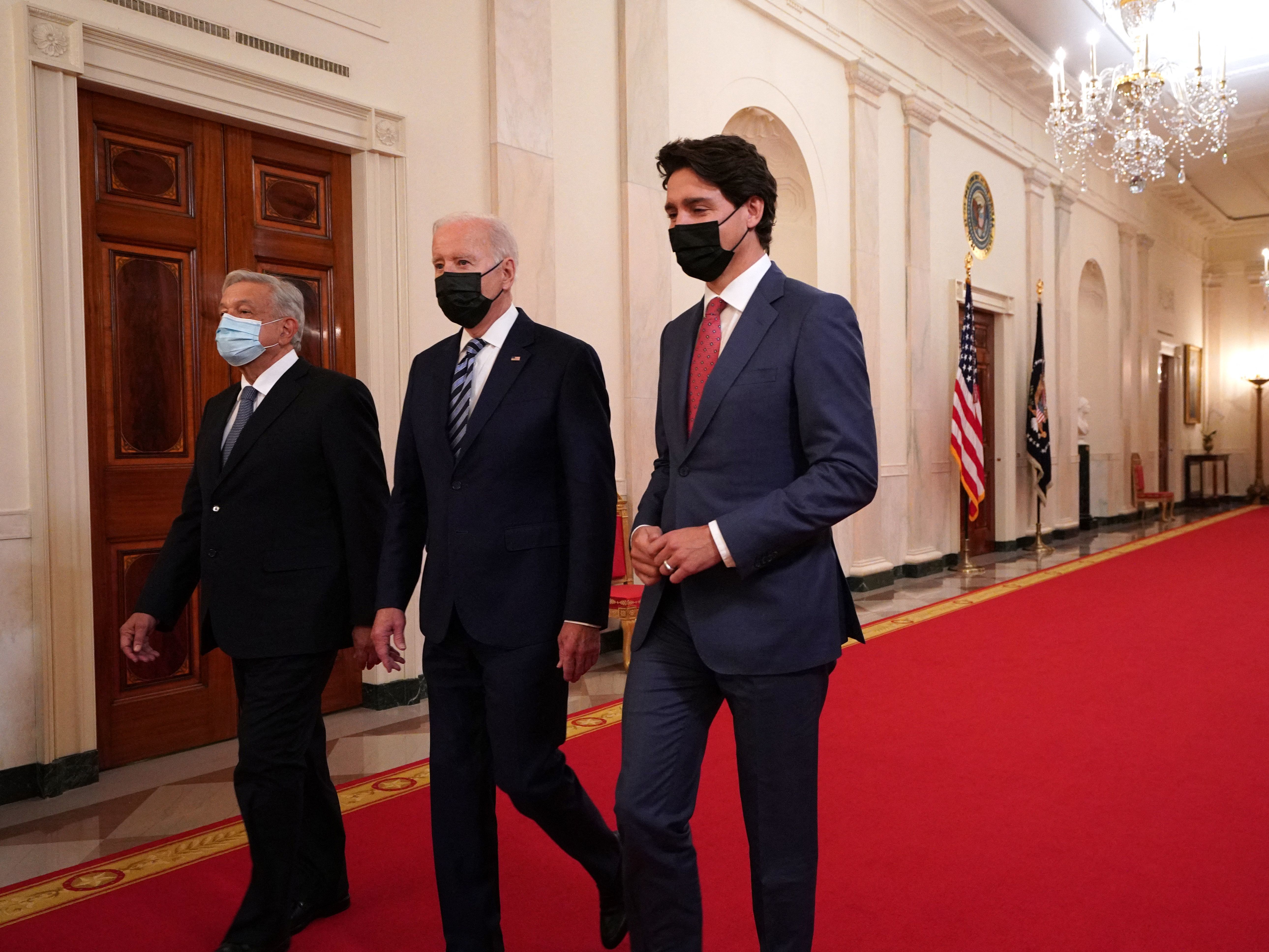 caption: President Biden is joined by Canadian Prime Minister Justin Trudeau (right) and Mexican President Andrés Manuel López Obrador for the North American Leaders' Summit at the White House on Thursday.