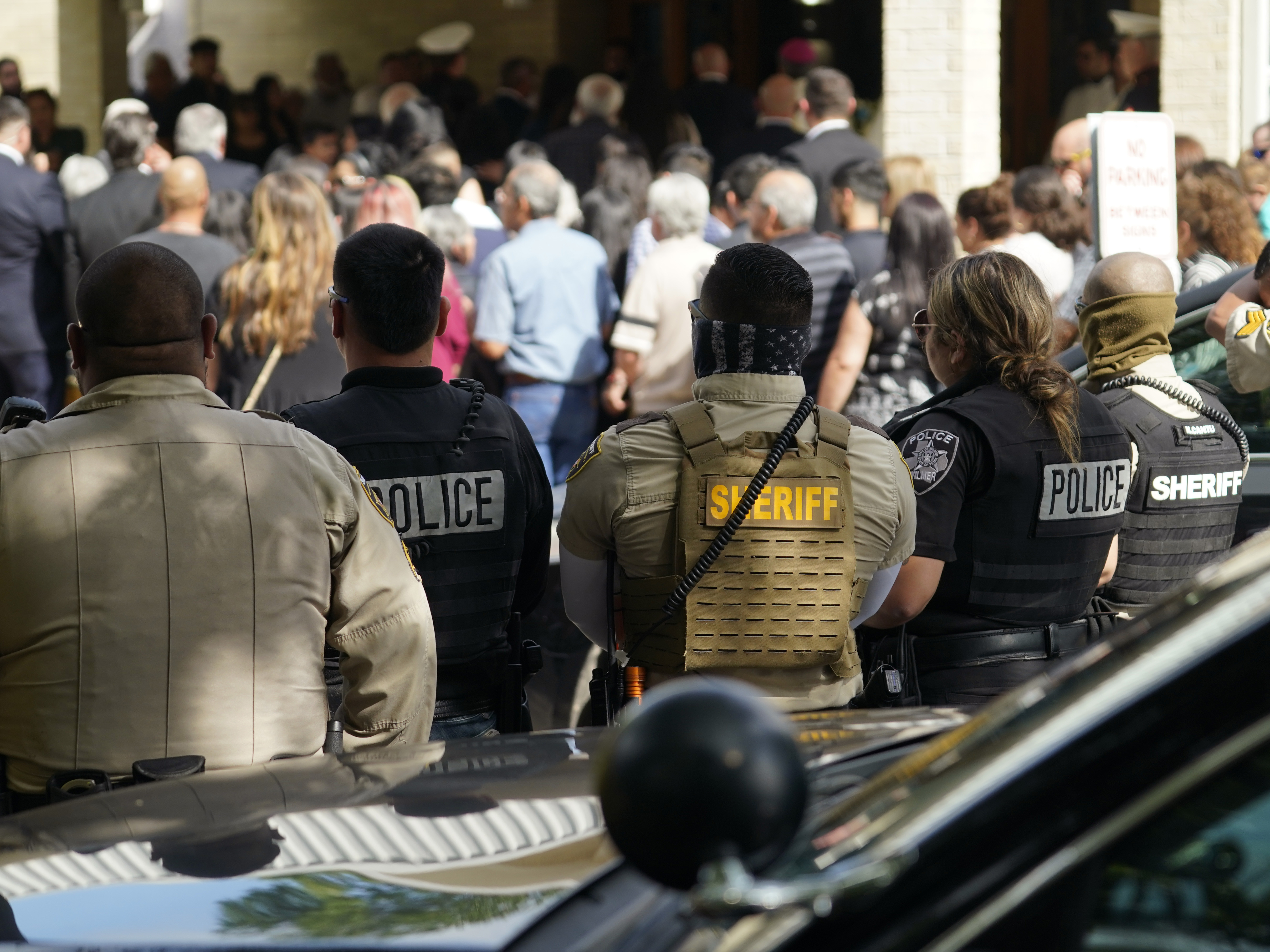 caption: Guests arrive at the joint funeral service for Irma Garcia and her husband, Joe Garcia, at Sacred Heart Catholic Church in Uvalde, Texas, on Wednesday. Schoolteacher Irma Garcia died in the May 24 school shooting in Uvalde, and her husband died two days later of a heart attack.