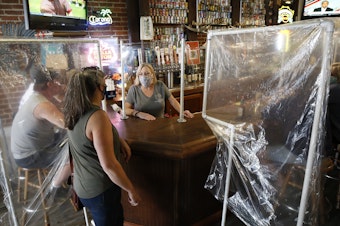 caption: Powell's Steamer Co. & Pub reopened to patrons on Wednesday. The pub is in Placerville, El Dorado County, Calif., one area that's entered Expanded Stage 2 of reopening its economy.