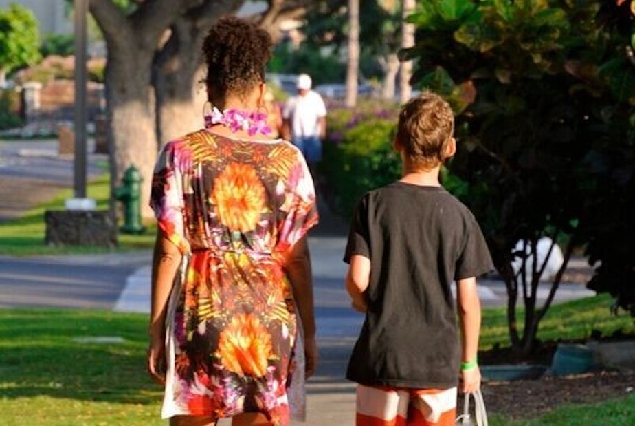 caption: A family photo of Adina and her son Ruben walk back from a day at the pool. Now Ruben is a teenager and has been experimenting with drugs.