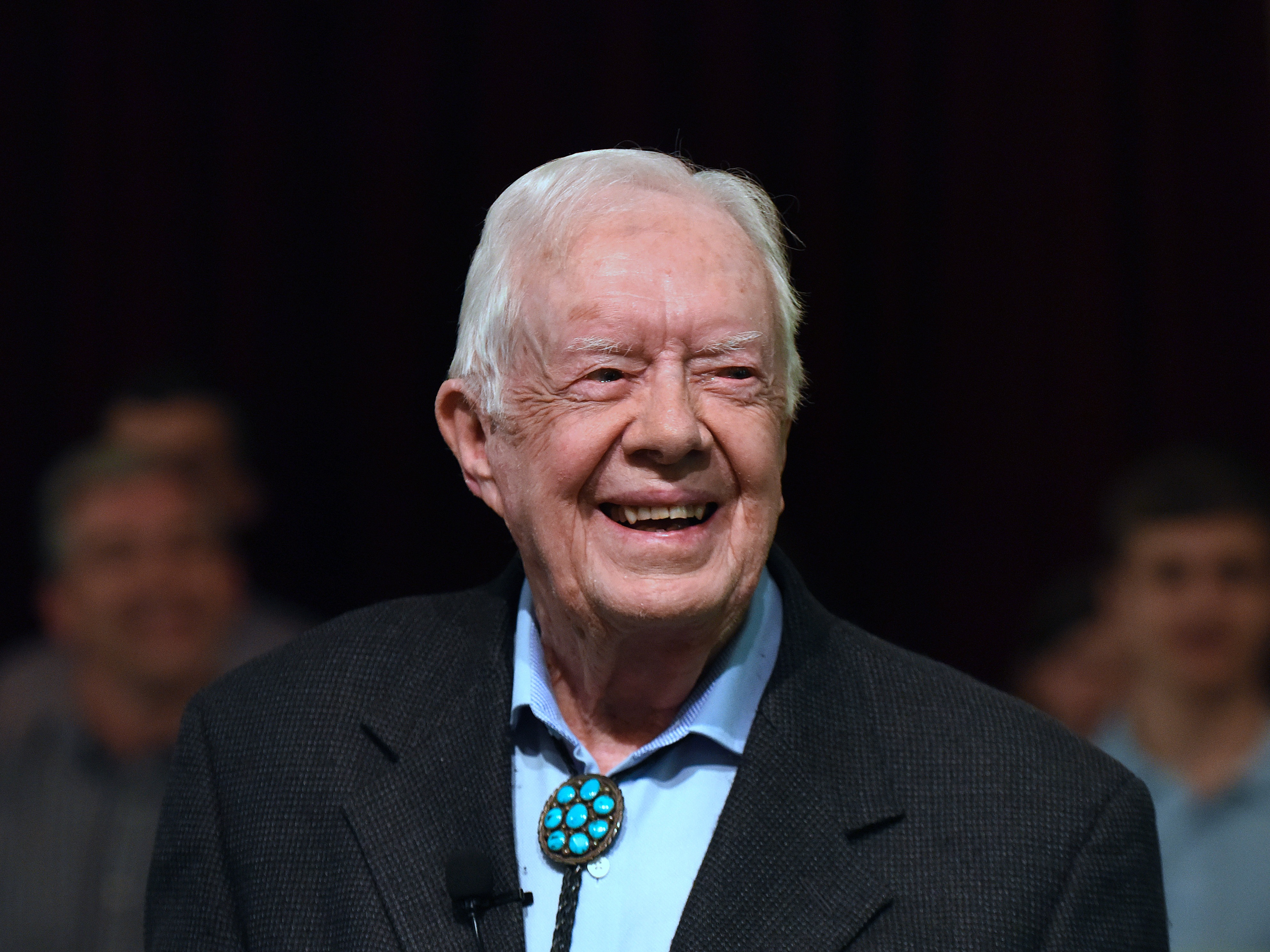 caption: Former President Jimmy Carter speaks to the congregation at Maranatha Baptist Church before teaching Sunday school in his hometown of Plains, Ga., in April 2019. He taught Sunday school at the church on a regular basis after leaving the White House in 1981, drawing hundreds of visitors who would arrive hours early to get a seat.