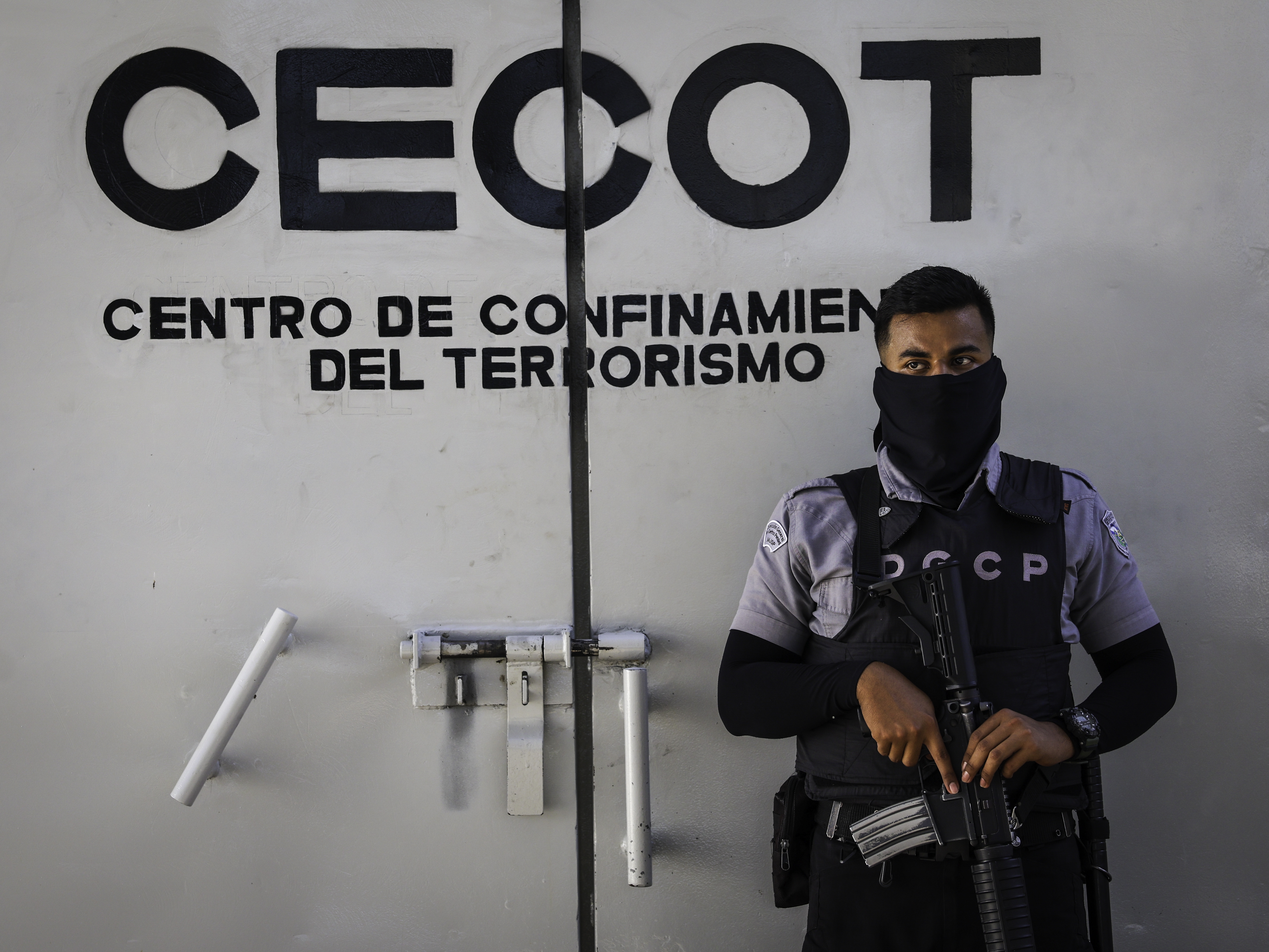 caption: A prison guard mans an interior perimeter at the CECOT (Counter Terrorism Confinement Center) on Dec.15, 2025 in Tecoluca, El Salvador. CECOT gained notoriety in 2025 when the Trump administration began its controversial policy of deporting people to El Salvador who they claimed were members of the Venezuelan gang Tren De Aragua.