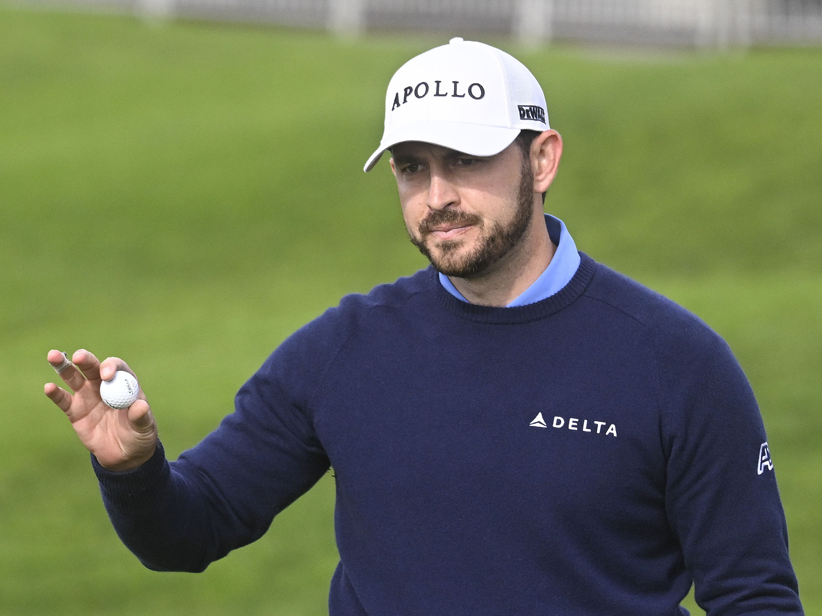 caption: Patrick Cantlay finishes the first round at Torrey Pines, at the Farmers Insurance Open golf tournament in San Diego on Jan. 24. He is a member of the PGA Tour board, which unanimously approved a $3 billion deal with an investment group.