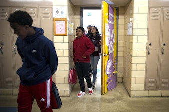 caption: Seventh-grade students leave Janet Bautista's science class as the bell rings on Thursday, March 28, 2019, at Asa Mercer Middle School in Seattle.