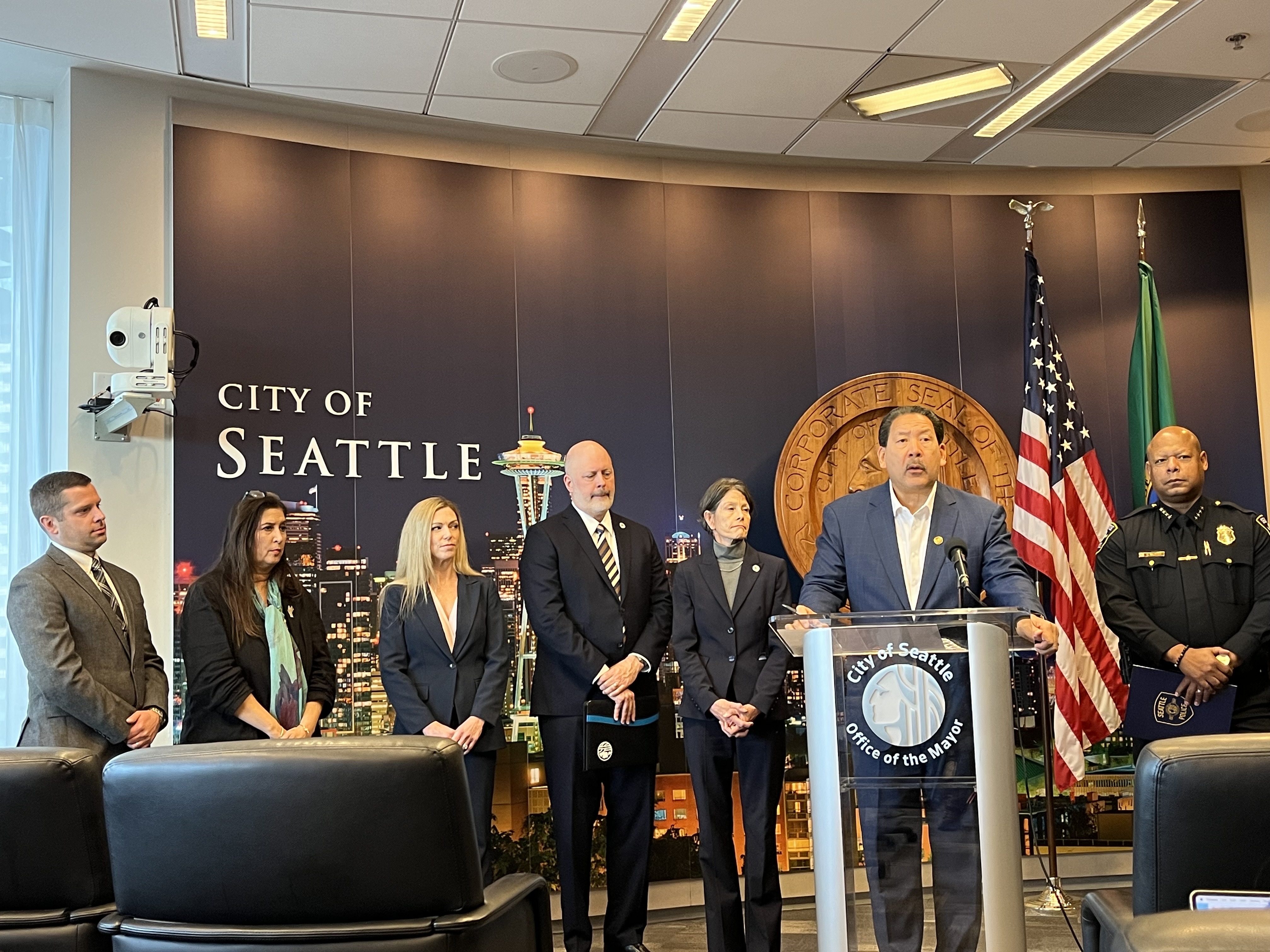 caption: Mayor Bruce Harrell and other city leaders announce a new proposed contract with the Seattle Police Officers Guild at a press conference on Wednesday, Oct. 22, 2025. 