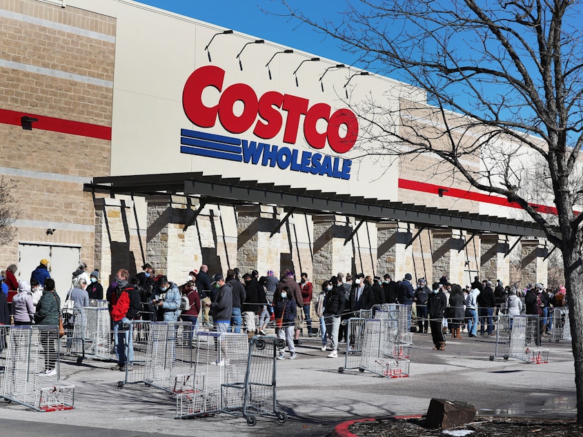 caption: People wait to shop at the Costco Wholesale in Austin on Feb. 20.