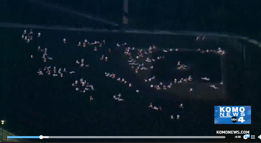 caption: This image from KOMO TV shows inmates at the Monroe Correctional Complex in the prison yard following a disturbance at the prison Wednesday night.