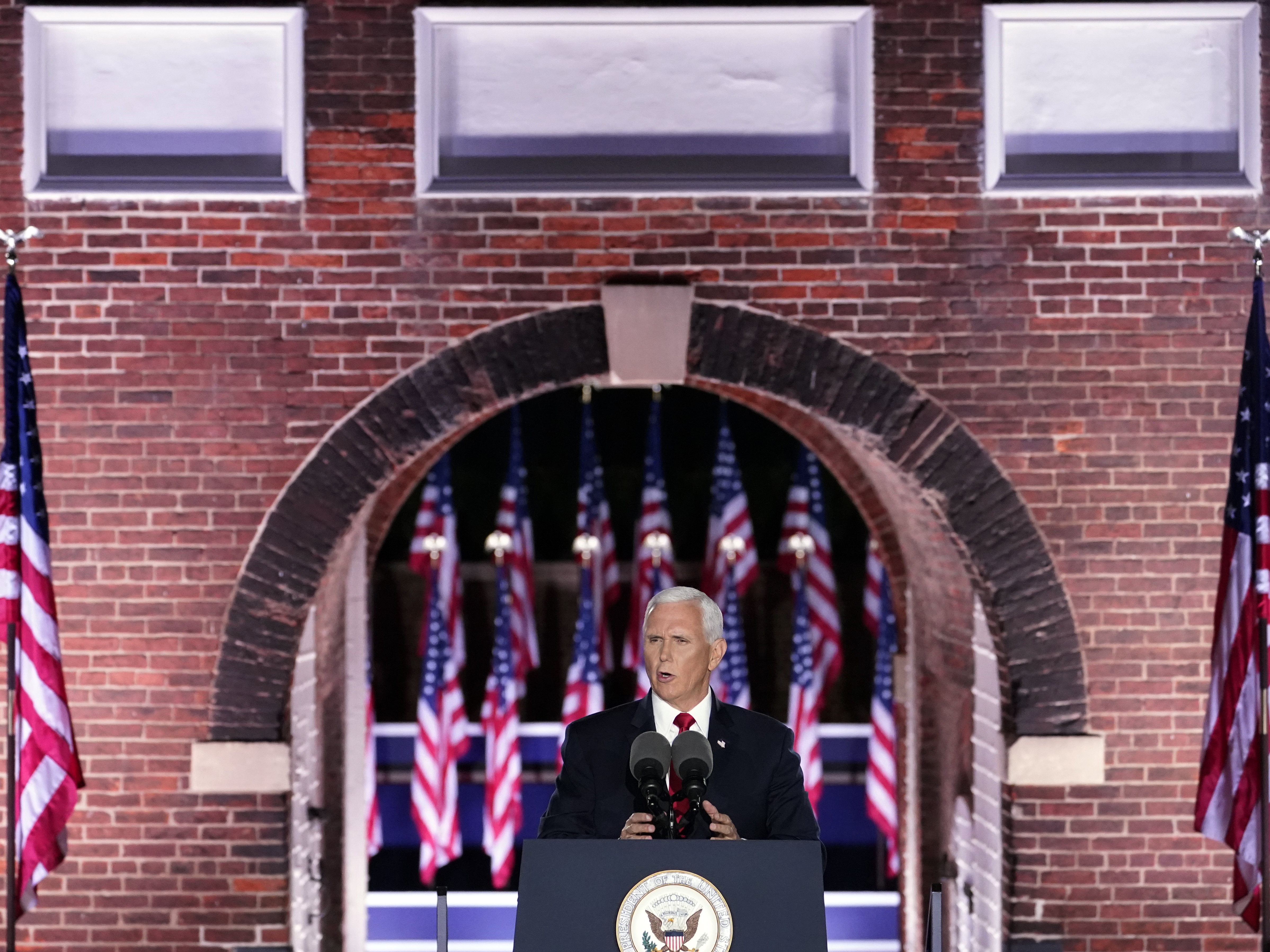 caption: Vice President Pence speaks on the third day of the Republican National Convention at Fort McHenry in Baltimore. He stressed a law and order message as protests over racism and policing continue.