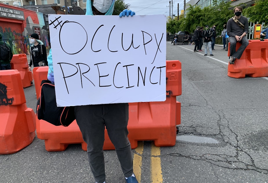 caption: Demonstrators in Capitol Hill on Monday, June 8, 2020.