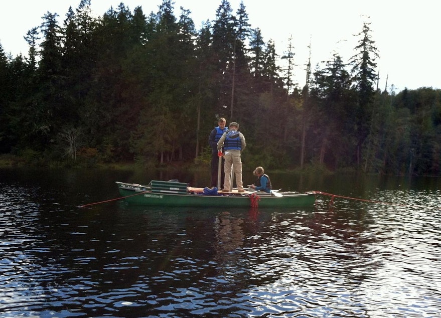 caption: On Leland Lake near Quilcene, Washington, the researchers pulled cores by hand from the lake bottom working from an improvised raft rig.
