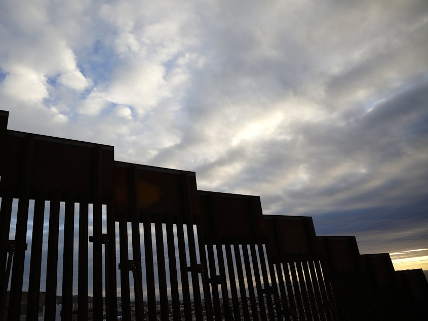 caption: A section of border wall separates Tijuana, Mexico, from San Diego, as seen from the U.S. in January. California has filed a lawsuit along with 15 other states, calling President Trump's use of a national emergency declaration to redirect money toward border wall construction unconstitutional.