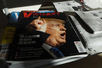 caption: A magazine's cover line in Beijing asks, "How will Trump the businessman change the world?" on Dec. 28, 2016, days after then President-elect Donald Trump tapped outspoken China critic Peter Navarro for a top trade position.