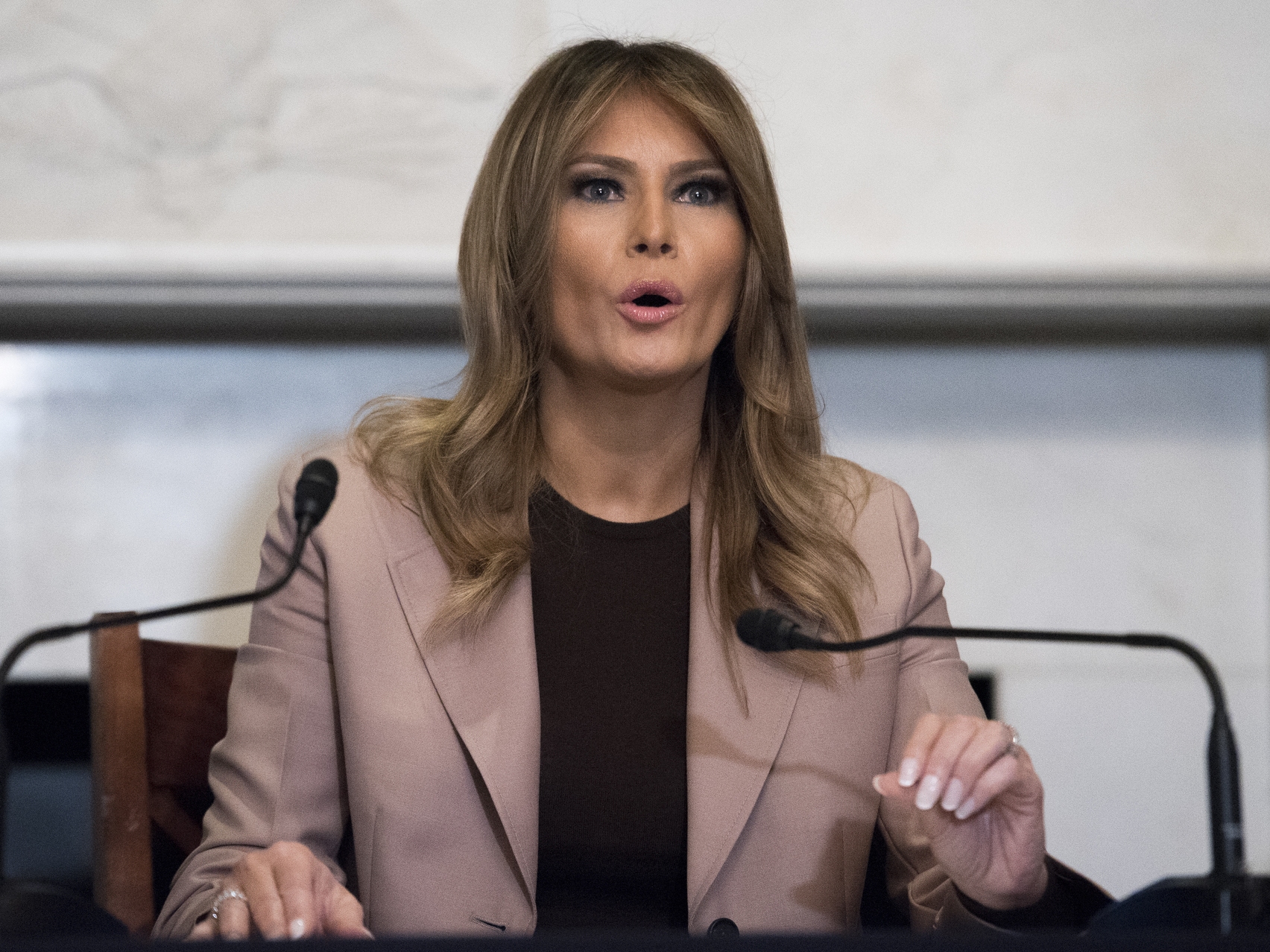 caption: In this Wednesday, Oct. 23, 2019, file photo first lady Melania Trump participates in a roundtable discussion on the opioid crisis, on Capitol Hill in Washington.