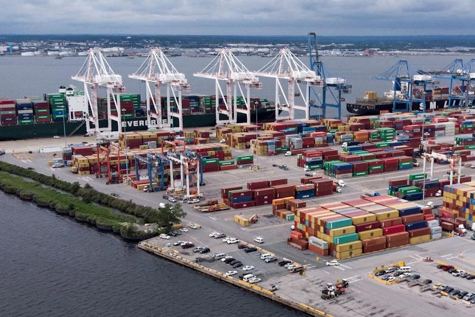 caption: Shipping containers sit piled at the Port of Baltimore on September 21, 2018 in Baltimore, Maryland.