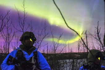caption: U.S. Army paratroopers conduct night live-fire training at Fort Greely, Alaska. The battalion spent much of Exercise Spartan Cerberus in subzero temperatures training in Arctic, airborne and infantry tasks.