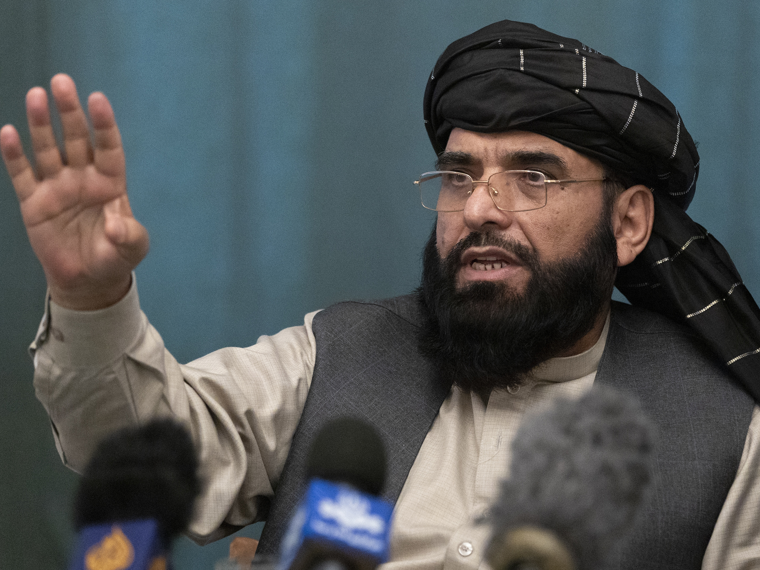 caption: Suhail Shaheen, Afghan Taliban spokesman, speaks during a news conference in Moscow in March 2021.