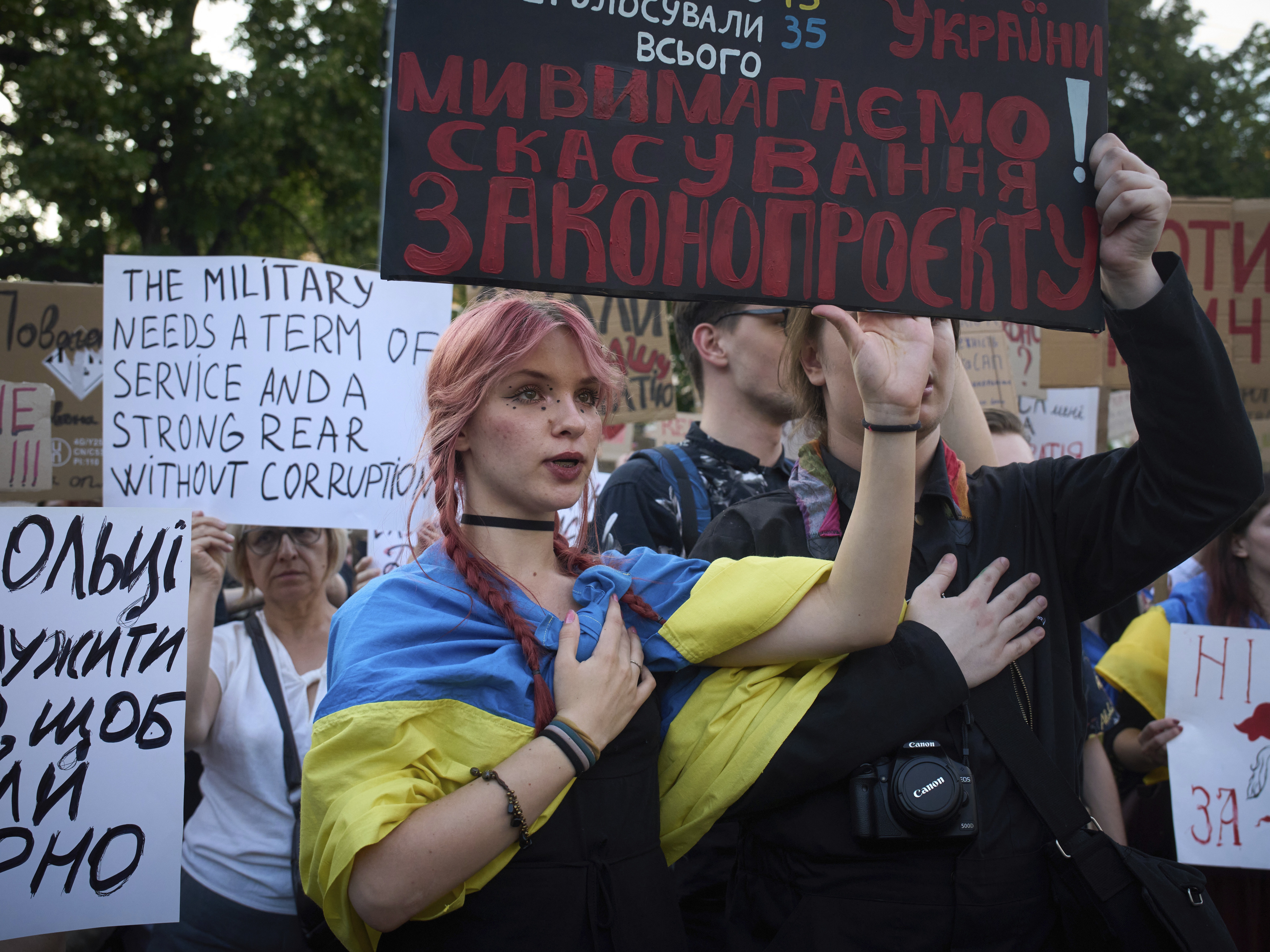 caption: Demonstrators protest against the bill proposed by President Volodymyr Zelenskyy in Kyiv, Ukraine, Thursday.