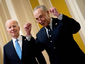 caption: President Joe Biden and Senate Majority Leader Chuck Schumer speak to reporters as they depart the Senate Democrat policy luncheon at the Capitol on March 2.