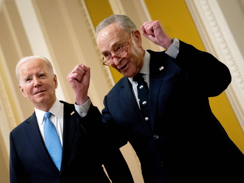 caption: President Joe Biden and Senate Majority Leader Chuck Schumer speak to reporters as they depart the Senate Democrat policy luncheon at the Capitol on March 2.