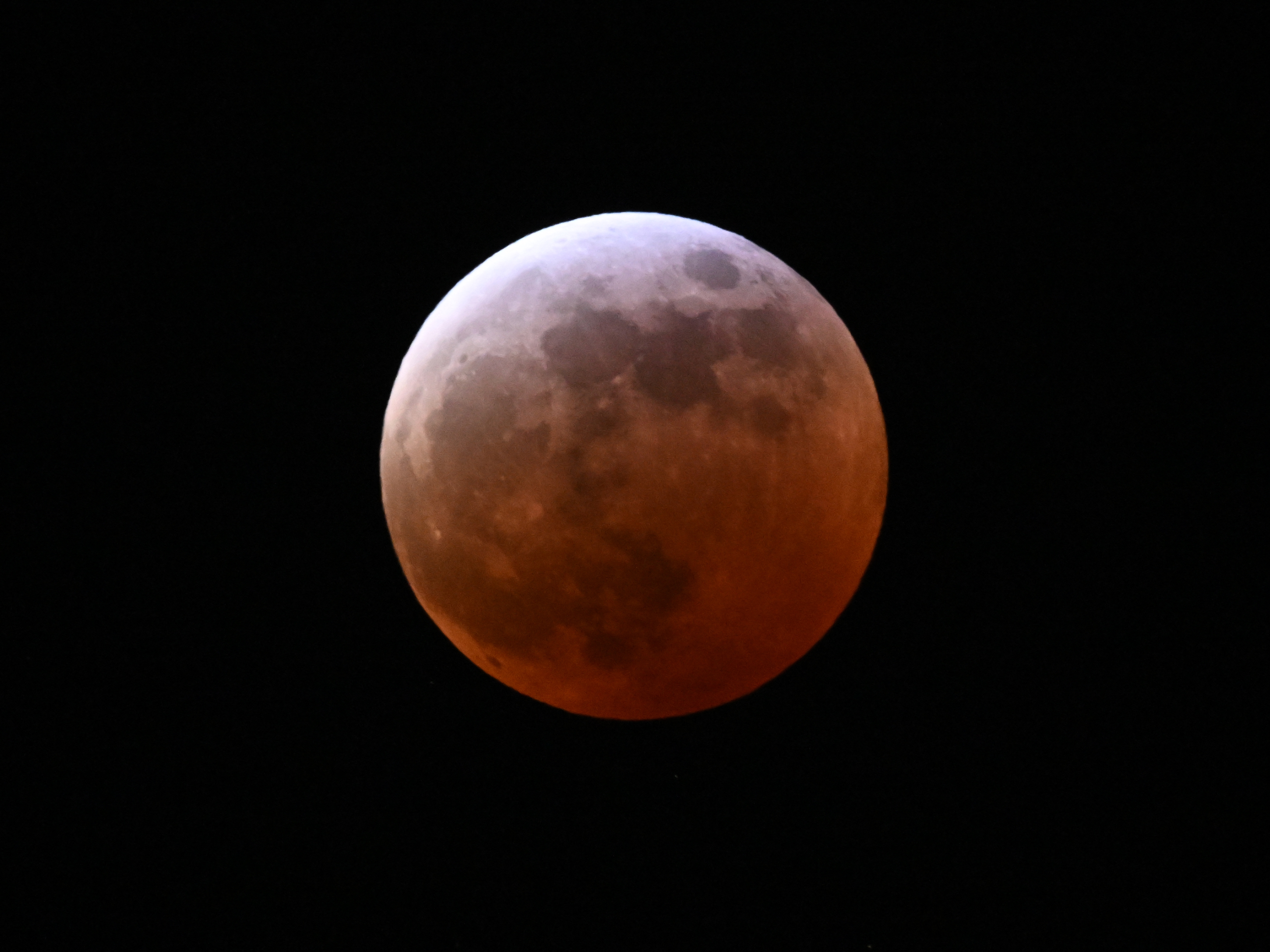 caption: A full lunar eclipse is seen during the Blood Moon Lunar Eclipse in Palm Springs, California, on Thursday.