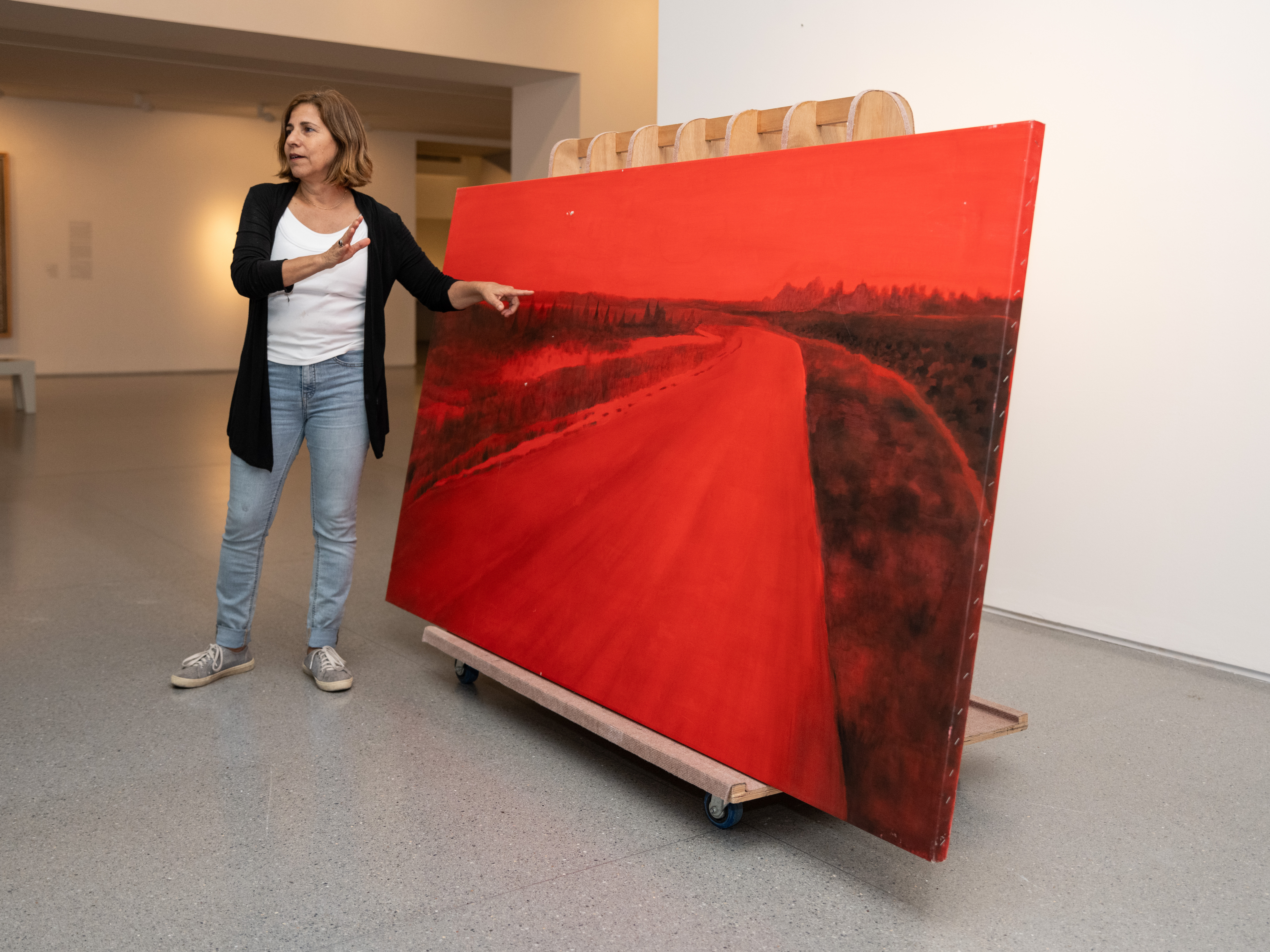 caption: Rescued from her studio in Kibbutz Be'eri near Israel's border with Gaza, artist Ziva Jelin's damaged painting <em>Curving Road </em>is currently on special display in the Israeli Art gallery of the Israel Museum in Jerusalem.