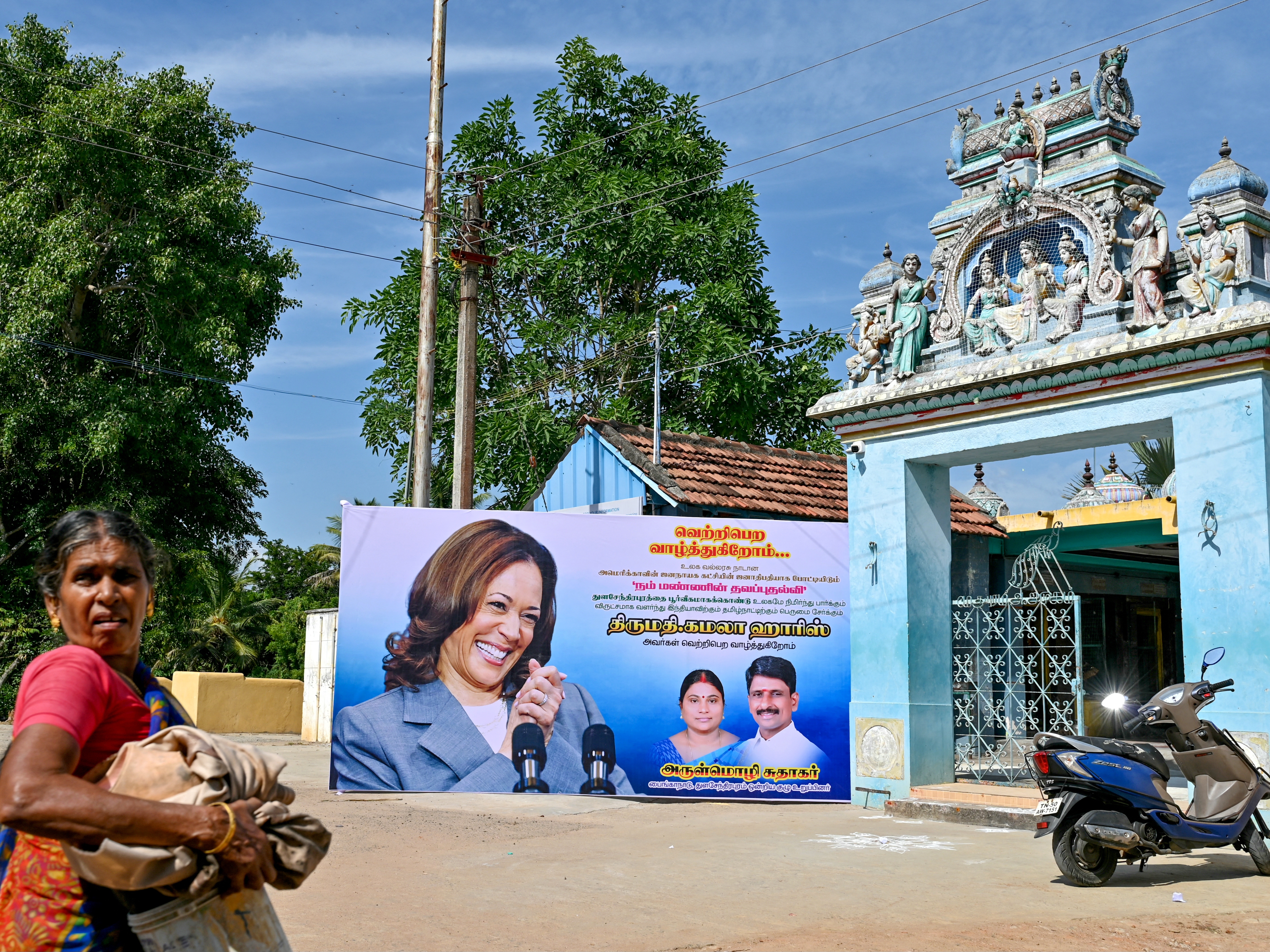 caption: A poster shows U.S. Vice President Kamala Harris in her ancestral village of Thulasendrapuram in the Indian state of Tamil Nadu on July 23, after President Biden stepped down as the Democratic Party nominee for president and endorsed Harris.
