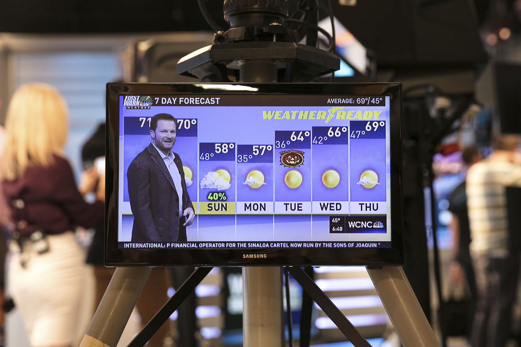 caption: Dale Earnhardt Jr. delivers a surprise seven-day forecast at a Charlotte news station ahead of weekend NASCAR race in Martinsville to help launch Goodyear's new WeatherReady tire on Friday, Oct. 27, 2017, in Charlotte, N.C. (Jason Walle/AP Images for Goodyear)
