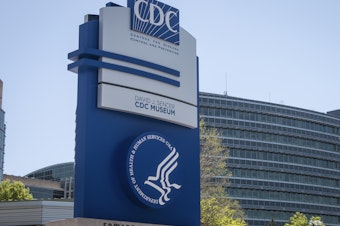caption: A sign at the entrance to the Centers for Disease Control and Prevention is seen on April 19 in Atlanta.