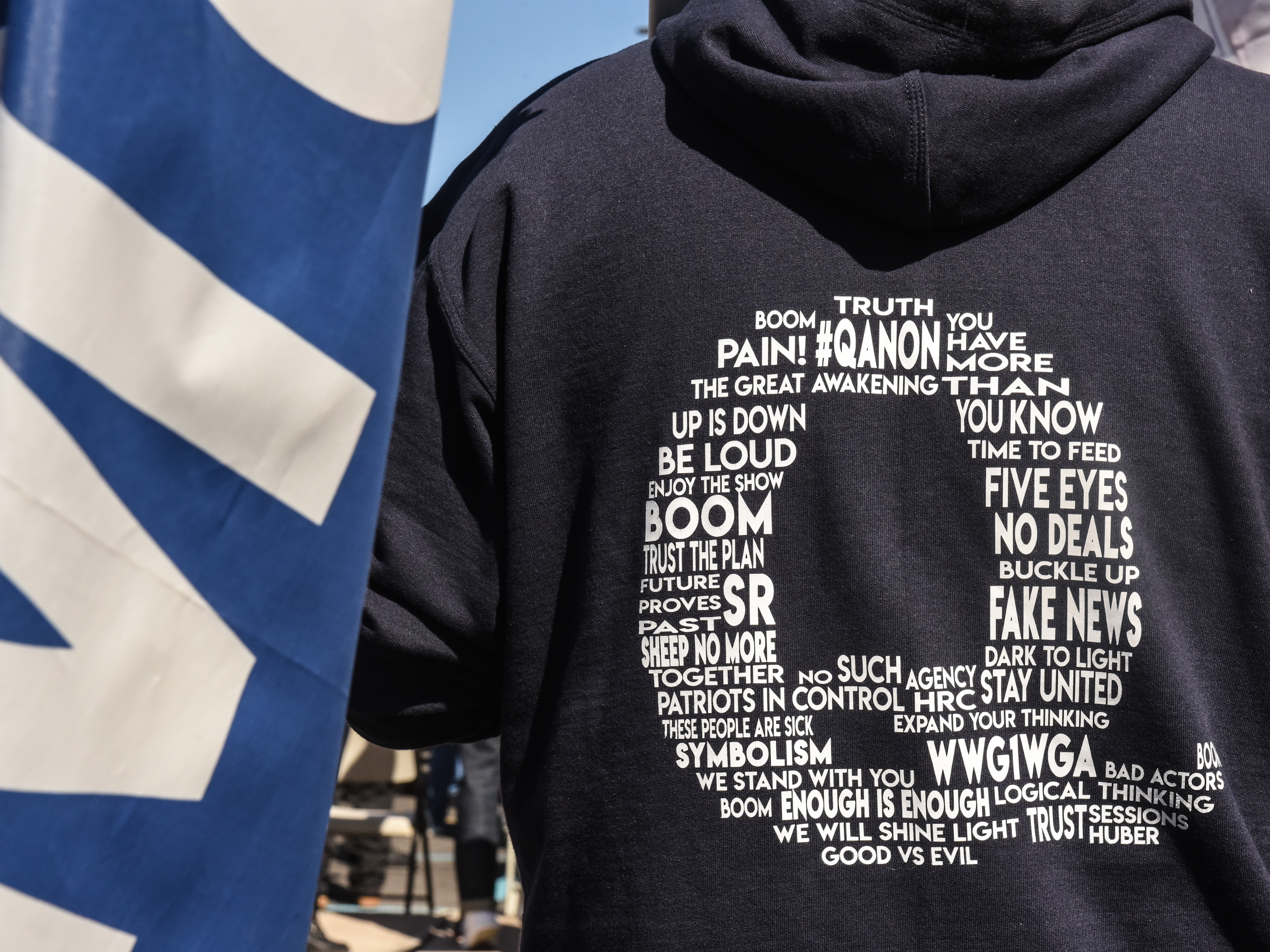 caption: With social media platforms cracking down on the baseless QAnon conspiracy theory, adherents are scrambling to find other ways to communicate.