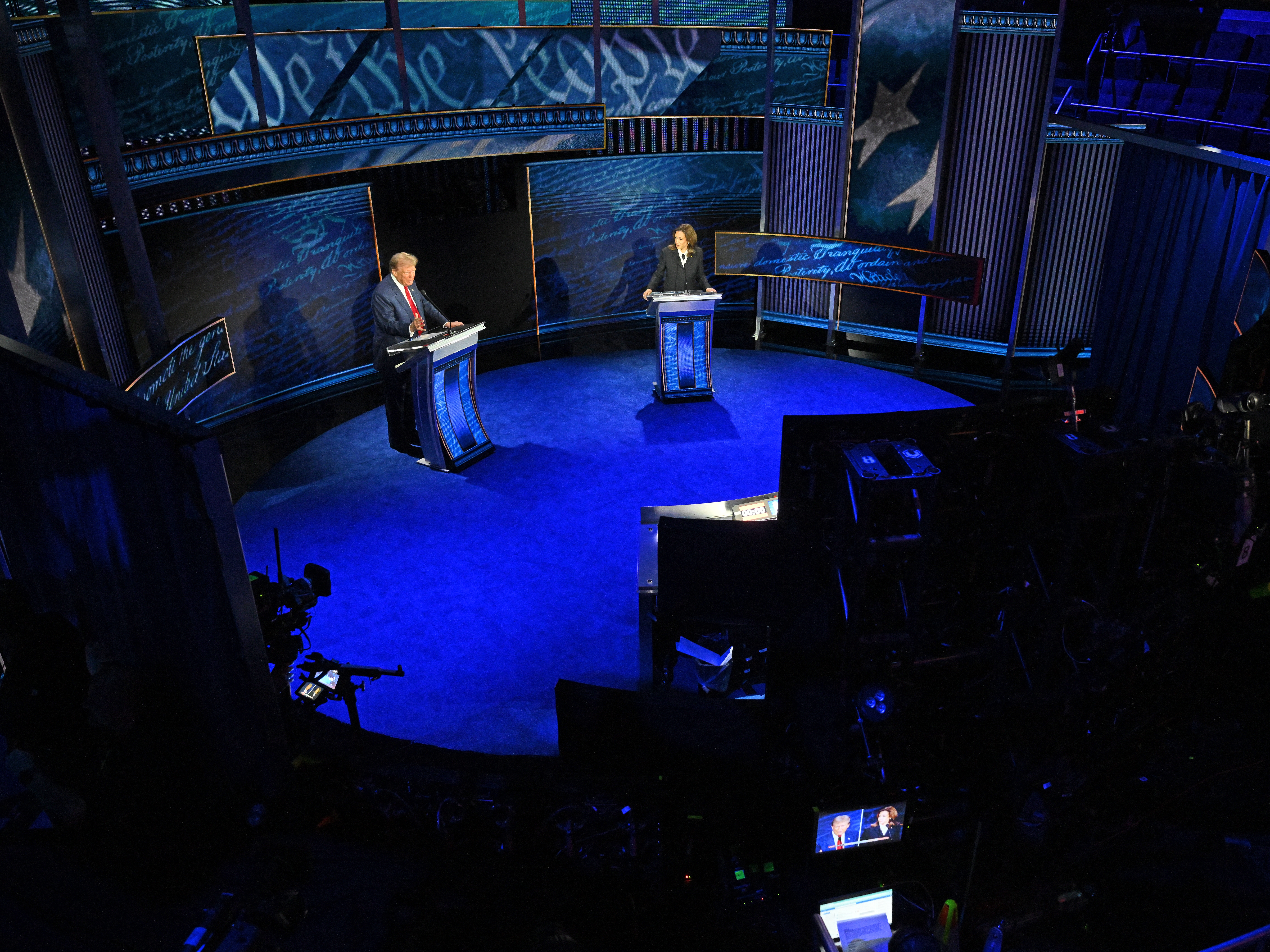 caption: Vice President and Democratic presidential candidate Kamala Harris and former President and Republican presidential candidate Donald Trump speak during a presidential debate.