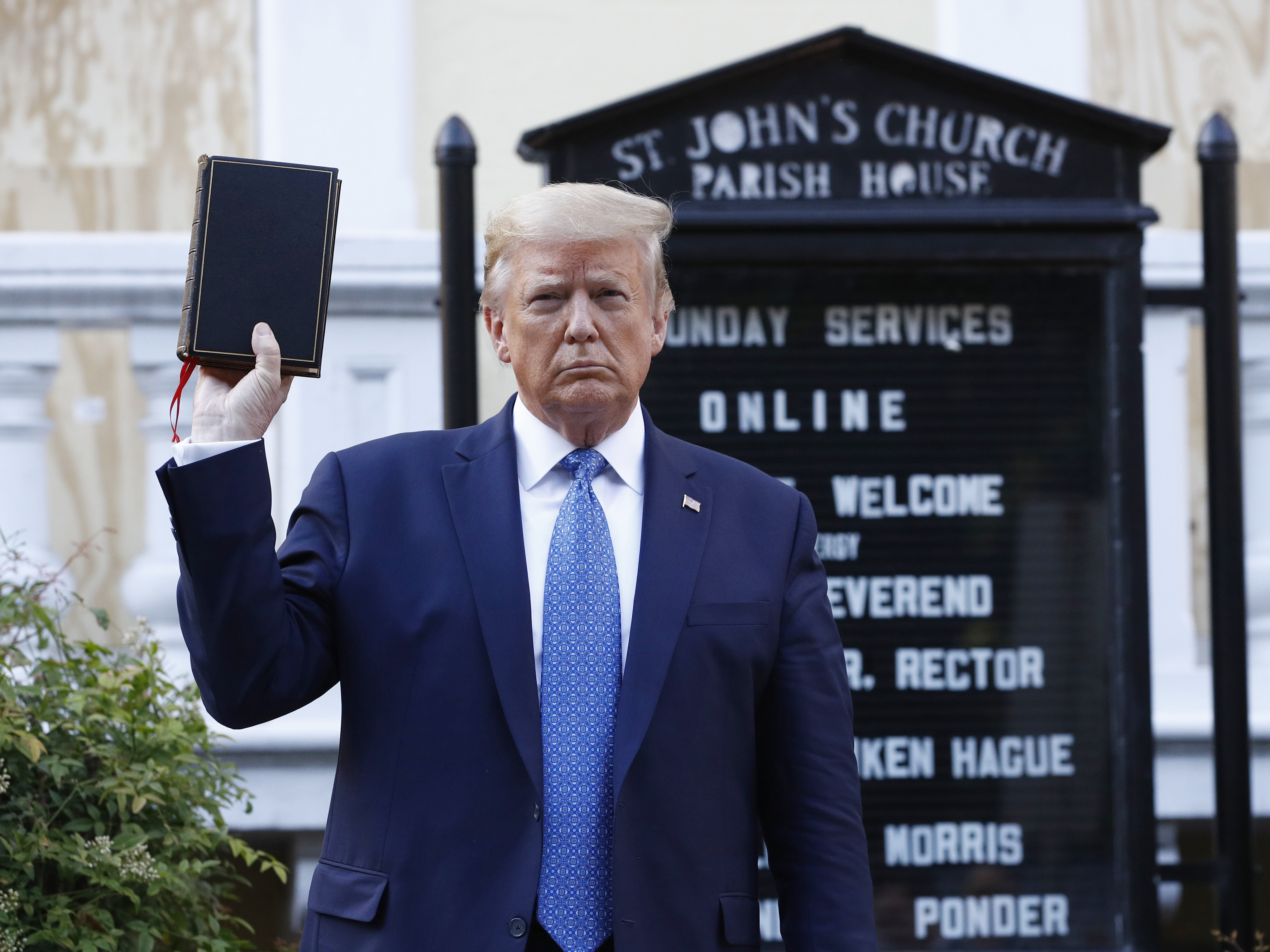 caption: Then-President Donald Trump holding a Bible as he visits outside St. John's Church across Lafayette Park from the White House on June 1, 2020.
