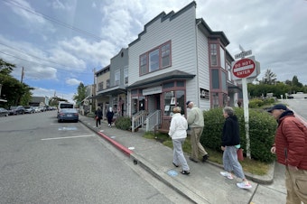caption: Tourists on Front Street in Coupville