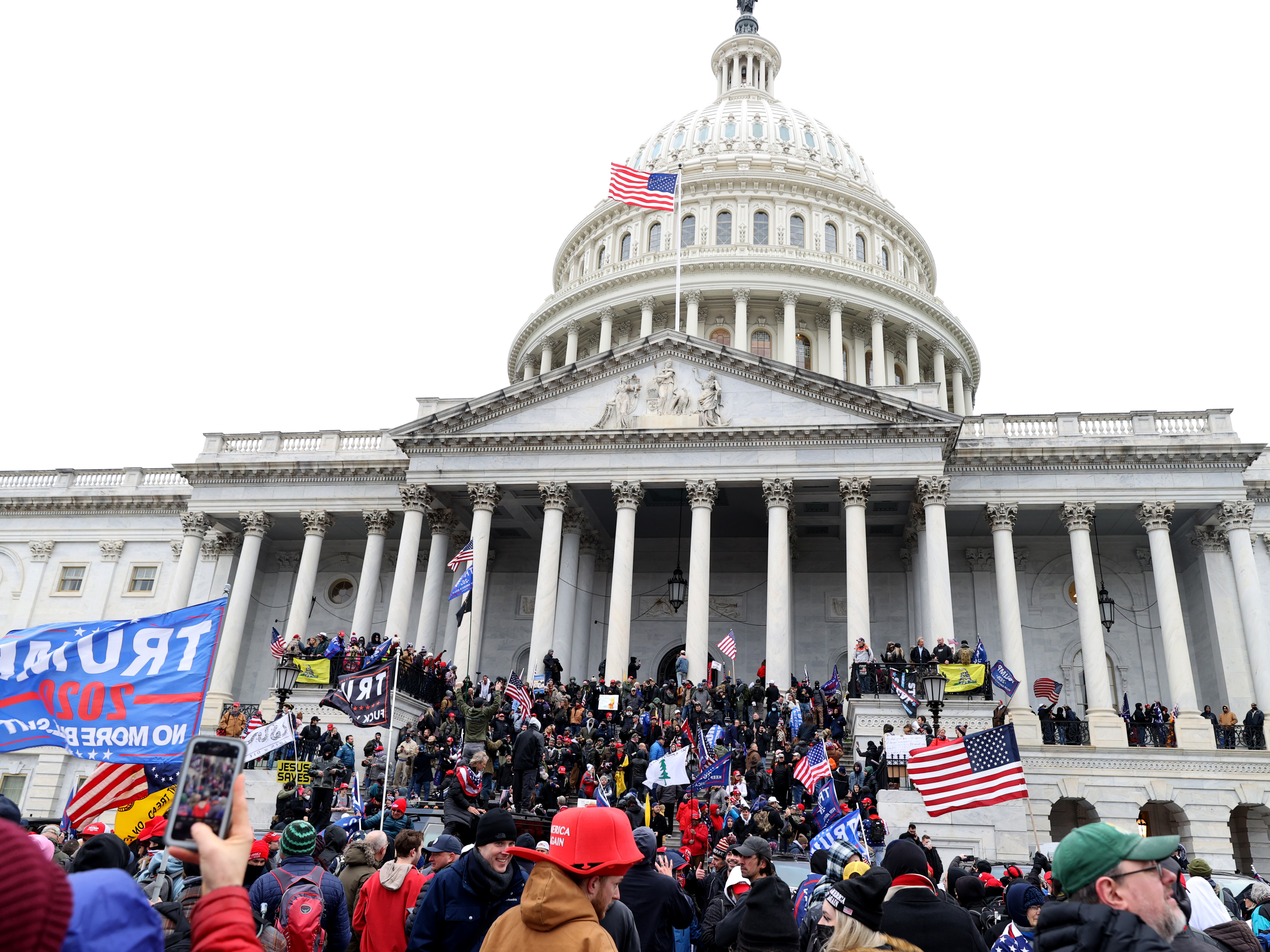 caption: Pro-Trump protesters seeking to force Congress to overturn the election results swarm the U.S. Capitol on Jan. 6, two weeks before President-elect Joe Biden is scheduled to gives his inaugural address there.
