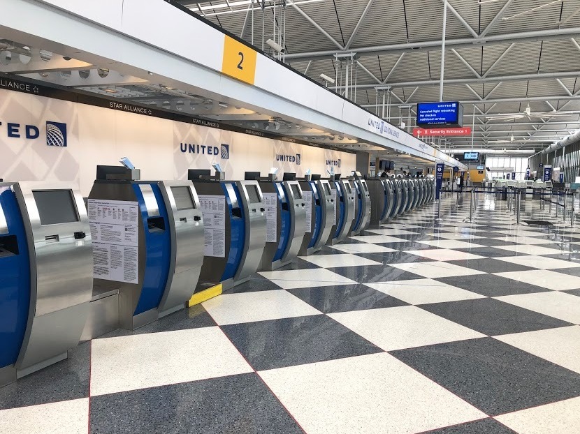caption: An empty terminal at Chicago's O'Hare International Airport. The normally bustling check-in at the United Airlines terminal was eerily quiet on April 24.