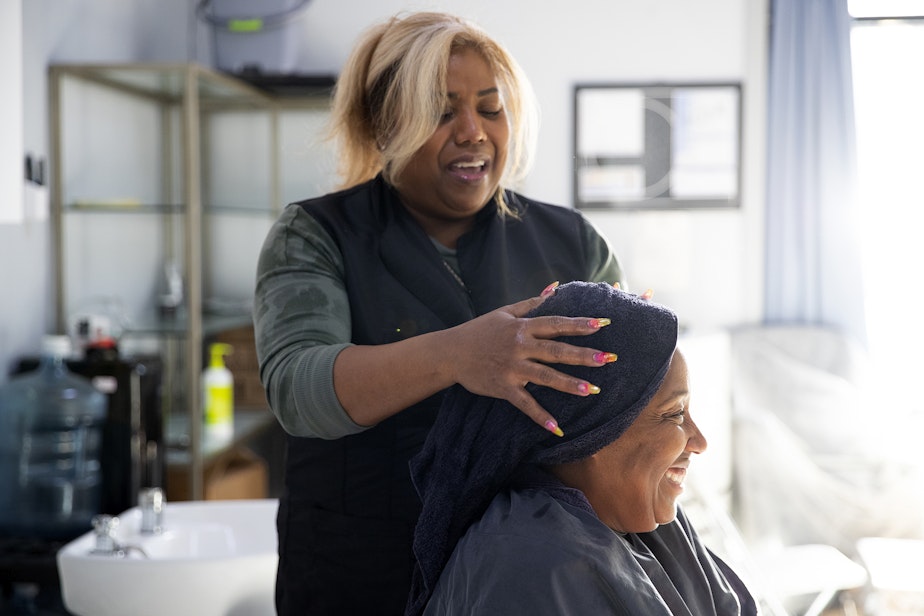 caption: Nina Trapp washes DaVonna Johnson’s hair during an appointment at Mati’s Salon and Barbershop on Friday, May 24, 2024, along Rainier Avenue South in Seattle. 