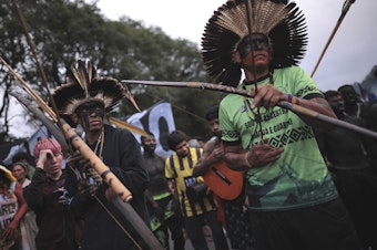 caption: Guarani Indigenous block Bandeirantes highway to protest proposed legislation that would change the policy that demarcates Indigenous lands on the outskirts of Sao Paulo.