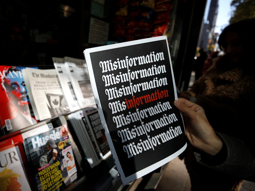 A news stand displaying a publication with the word "misinformation" printed on it is seen in Manhattan, New York, United States on October 30, 2018.