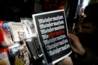 A news stand displaying a publication with the word "misinformation" printed on it is seen in Manhattan, New York, United States on October 30, 2018.