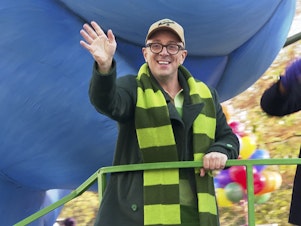 caption: Nickelodeon television show <em>Blue's Clues</em> host Steve Burns rides a float in the Macy's Thanksgiving Parade in New York City in November 2021.