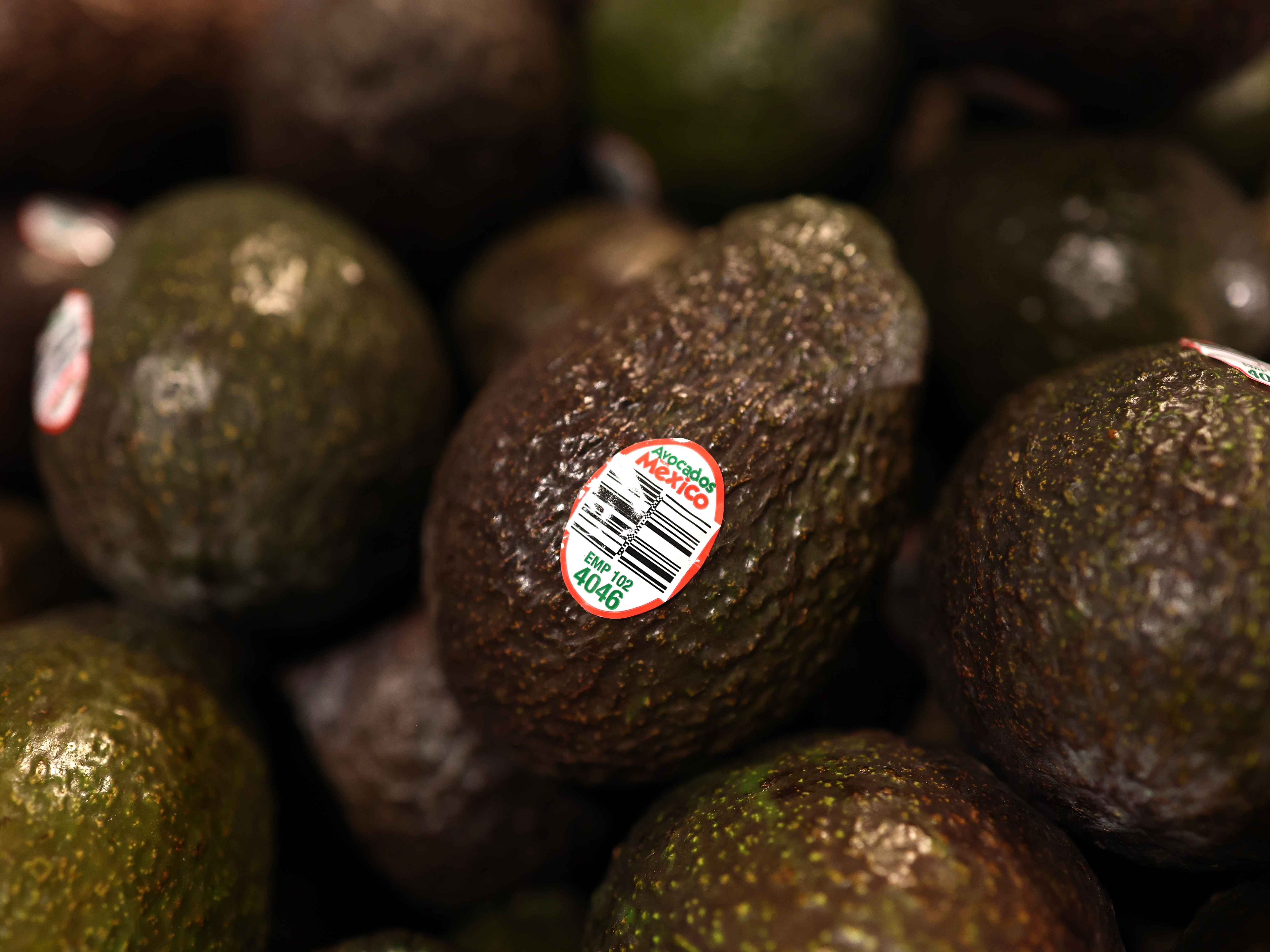 caption: Avocados from Mexico are displayed for sale at a Whole Foods store in New York City on Feb. 3. Trump has put on hold a planned 25% tariff on imports from Mexico.