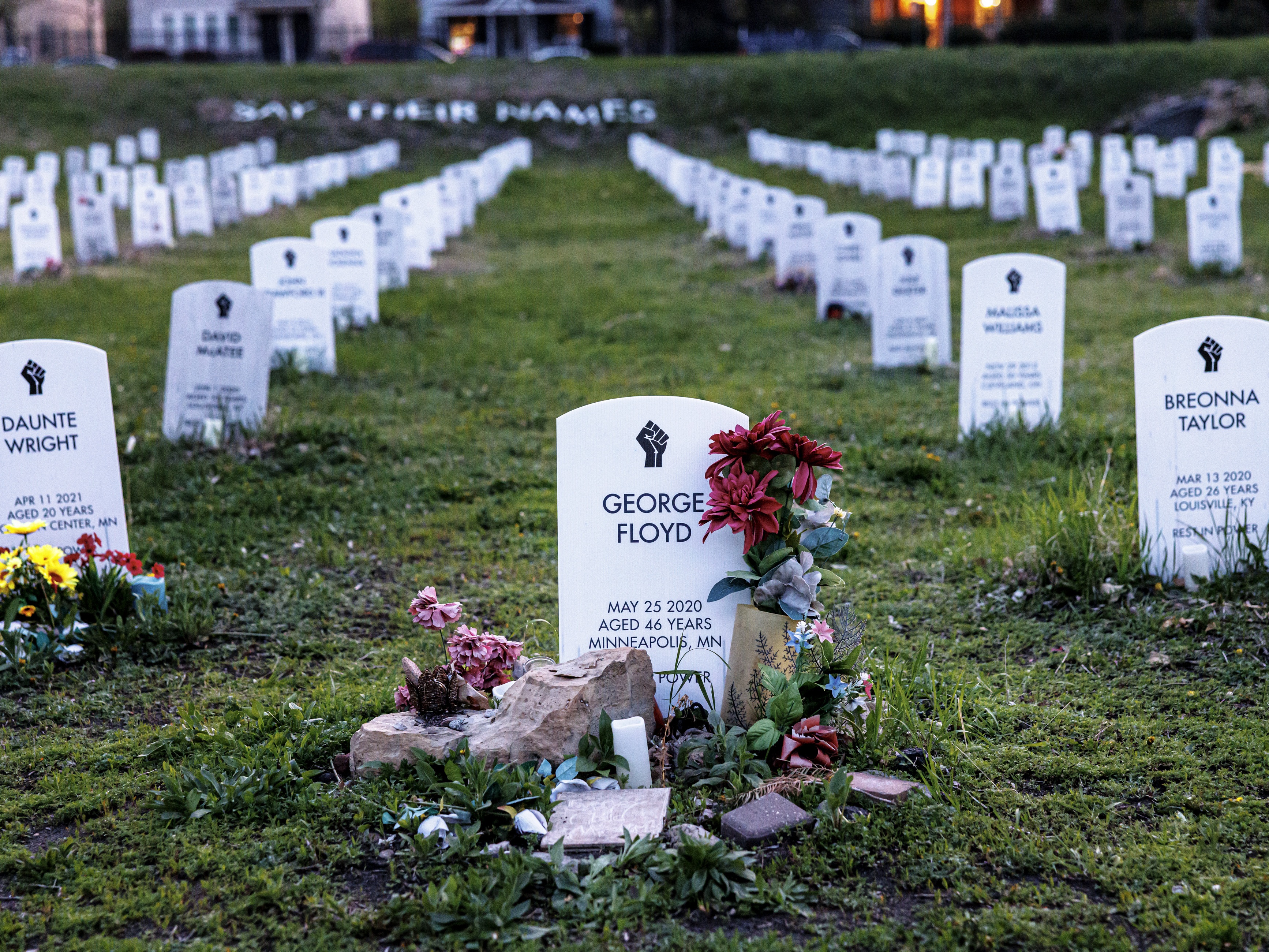 caption: Headstones bearing the names of people killed by law enforcement stand in the "Say Their Names" cemetery, a grassroots art installation created by two University of Pennsylvania students. Located just blocks from the George Floyd Memorial in South Minneapolis, the exhibit honors lives lost and calls for justice. Photographed on Saturday, May 10, 2025, in Minneapolis, Minn.