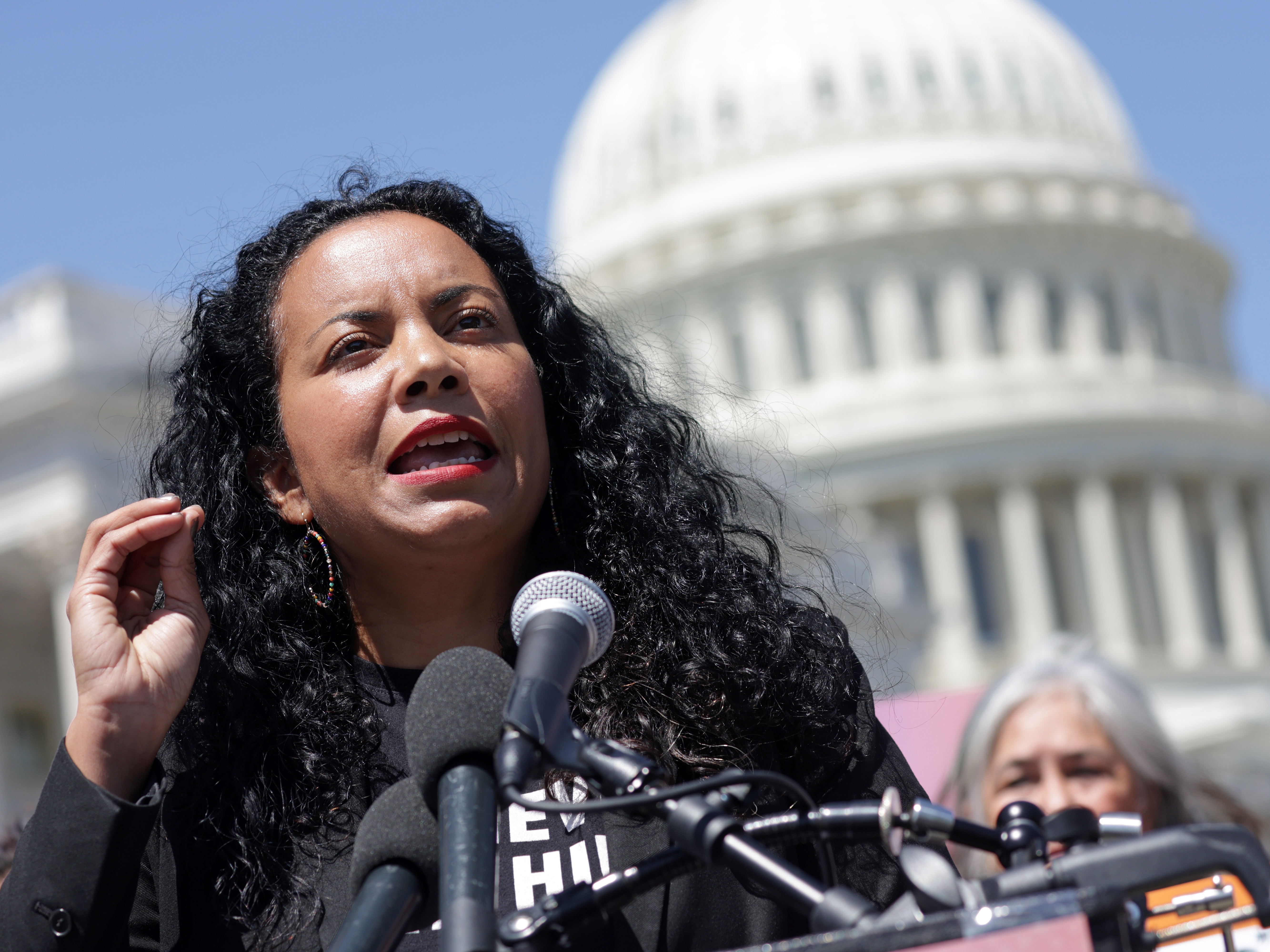 caption: Analilia Mejia, co-executive director of Center for Popular Democracy, speaks during a news conference outside the U.S. Capitol on April 19, 2023 in Washington, D.C.