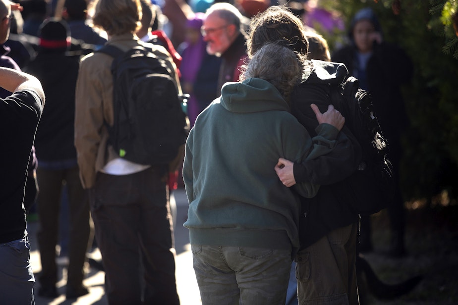 caption: Families reunite outside of Ingraham high school following a school shooting on Tuesday, November 8, 2022, in Seattle. 