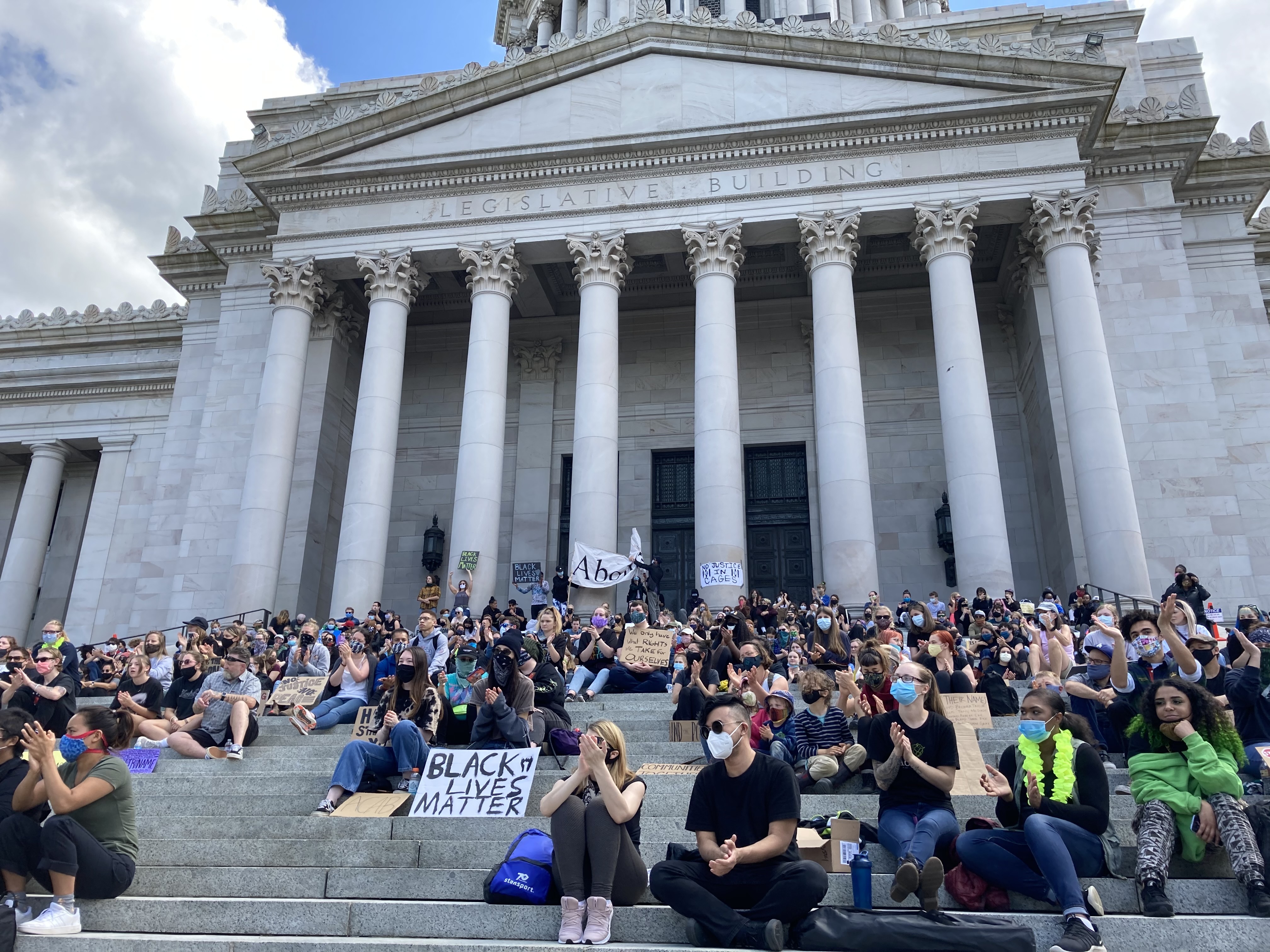 caption: Advocates for police accountability and racial justice rallied on the steps of the Washington Capitol in June. Now the Washington Legislature is taking up those issues as it welcomes a record number of lawmakers of color.
