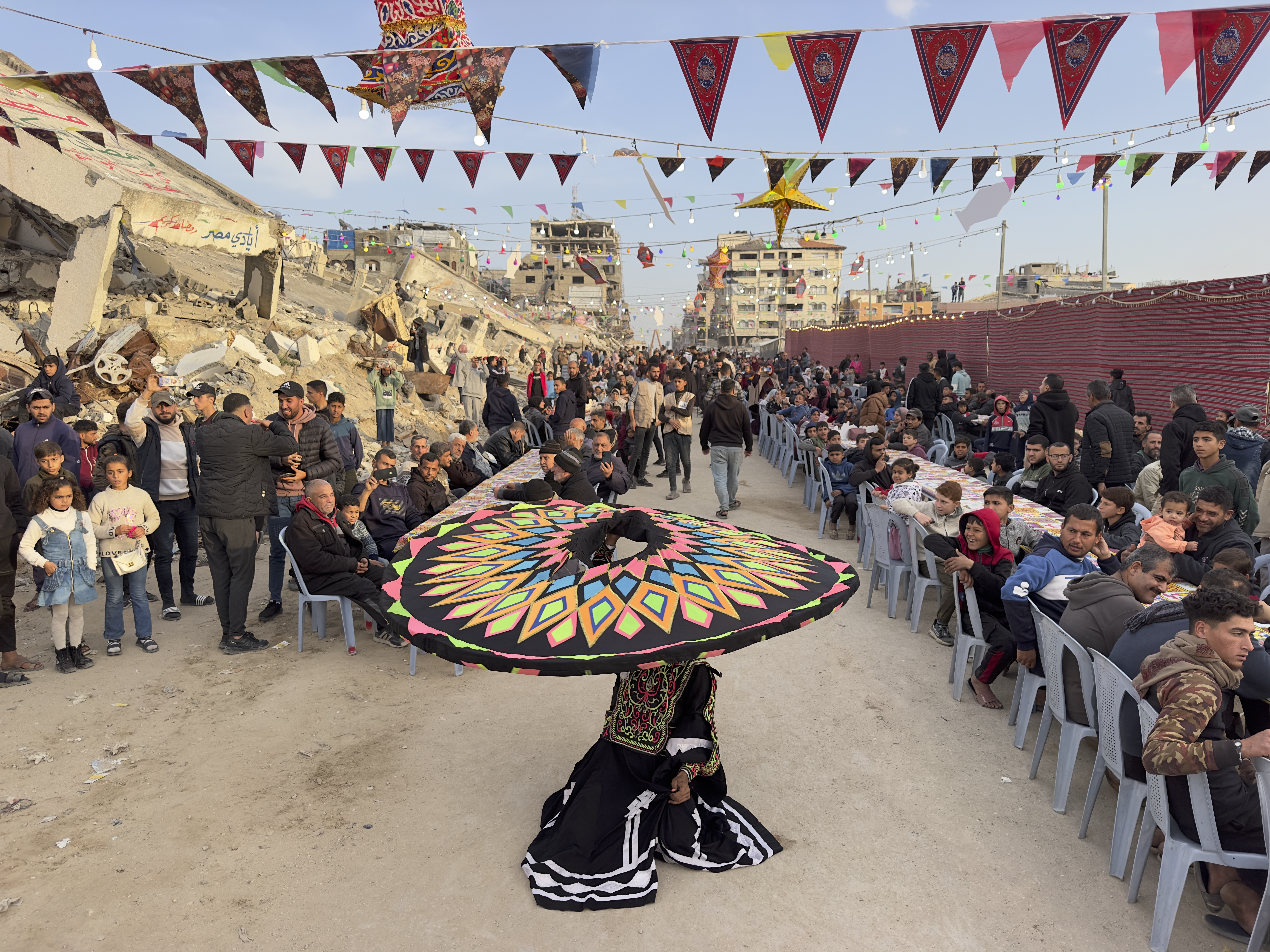 caption: Palestinians celebrate breaking the fast during the Muslim holy month of Ramadan in Gaza City, Gaza Strip, on March 6.