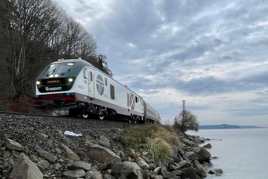 caption: The Amtrak Cascades heads north in Shoreline, Washington, on Nov. 30, 2023.