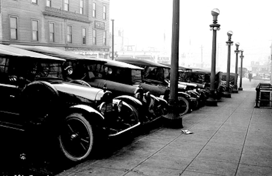 caption: Cars parked outside the Seattle Times Building in 1923.
