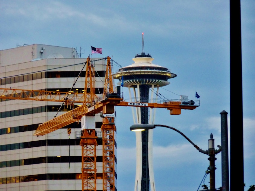 caption: Construction cranes in downtown Seattle.